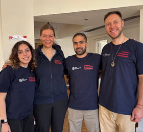 Emergency pedagogy Egypt Two men and two women with blue T-shirts and logo