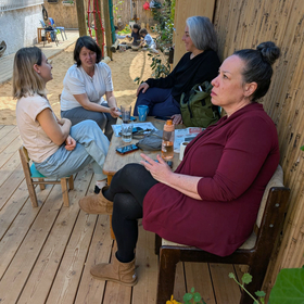 Waldorf Israel Four women are sitting on the terrace of a kindergarten in Israel