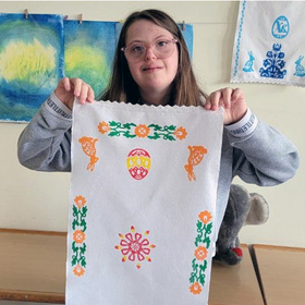 Girl shows off an embroidered Ukrainian towel